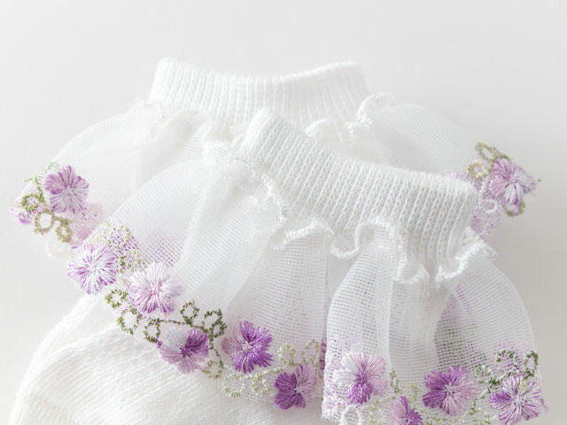 White lace Socks with floral embroidery on a light Purple