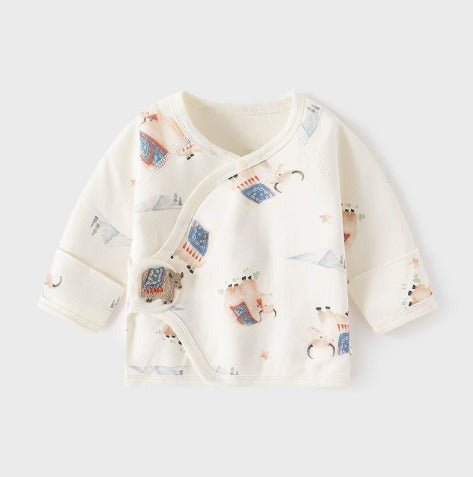 A baby long-sleeve wrap top in cream with a cute cartoon animal print, shown flat on a light gray background.