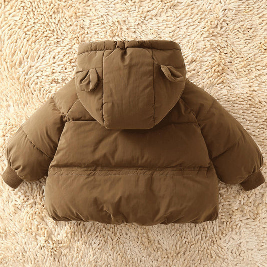 Brown puffer jacket with bear ears on a beige carpet