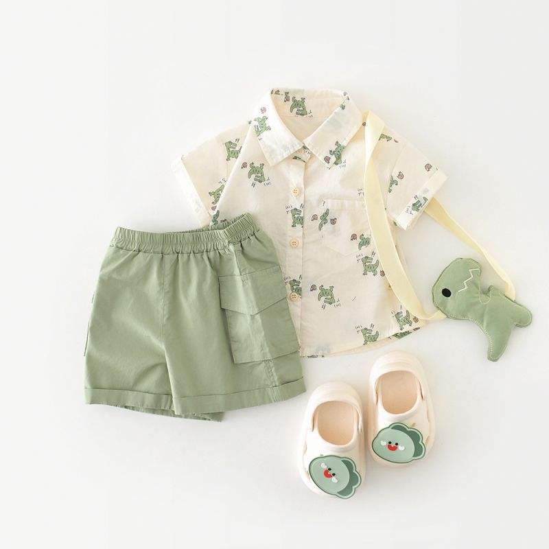 Children's outfit with shirt, shorts, and shoes on a white background