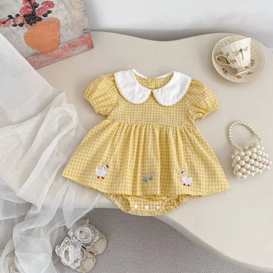 Yellow checkered dress with white collar and duck embroidery