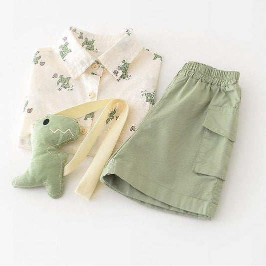 Children's outfit with shirt, shorts, and toy on a white background