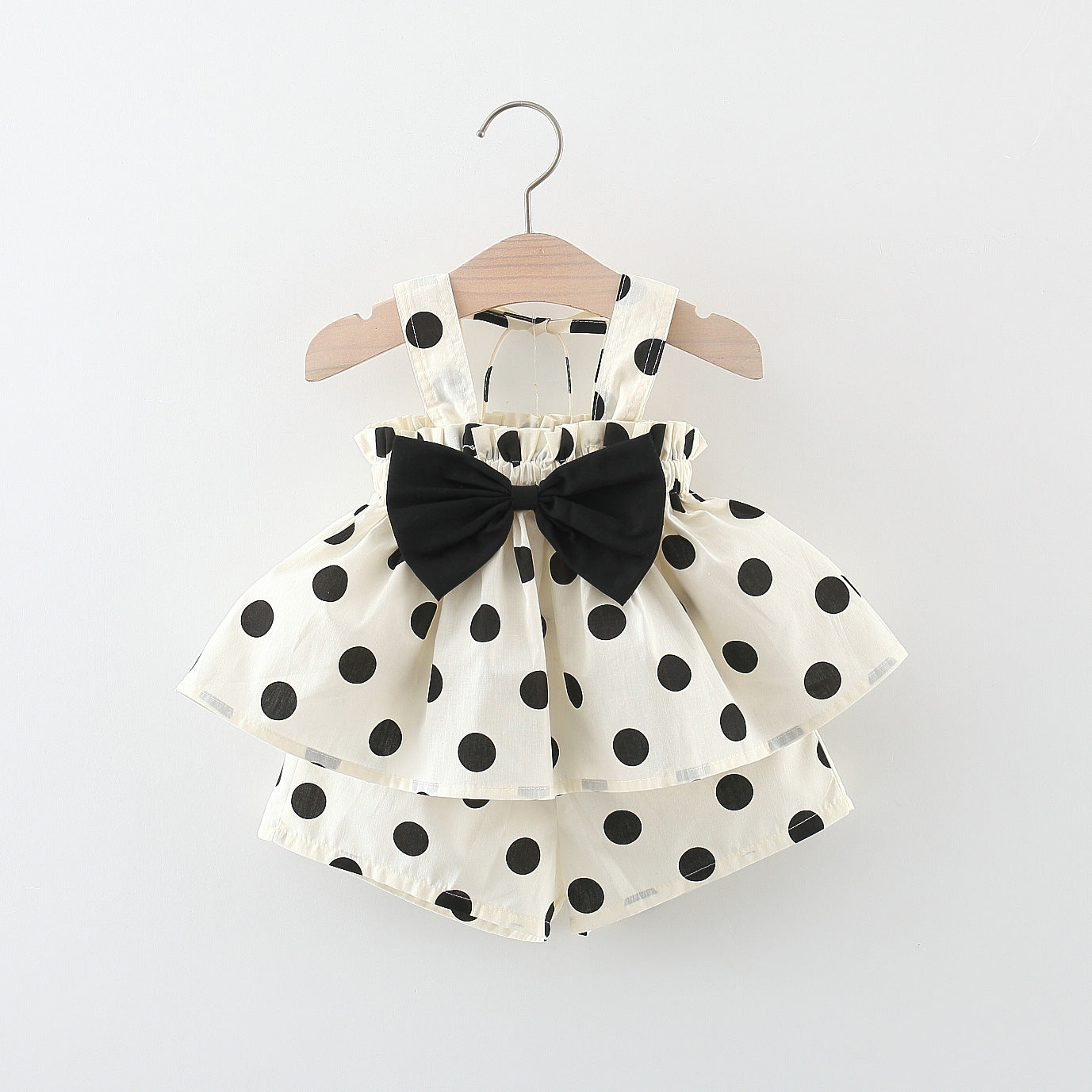 White dress with black polka dots and a large black bow by Crazy Toes