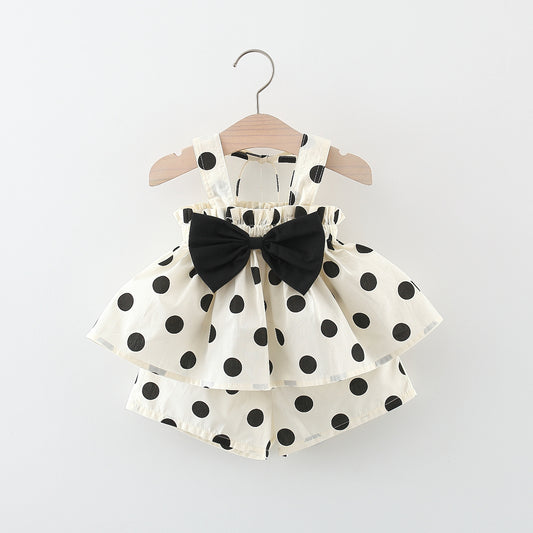 White dress with black polka dots and a large black bow by Crazy Toes