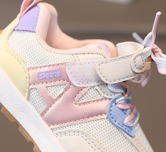 Pastel-colored children's sports shoe with visible brand name.