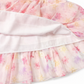 Floral skirt with ruffled layers on a white background