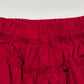 Red ruffled skirt on a white background
