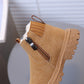 Brown boot with a zipper on a blurred background