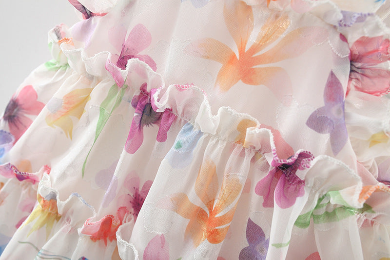 Close-up of a floral dress with colorful flowers and ruffles from Crazy Toes