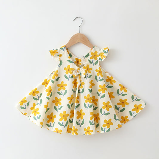 Yellow floral dress on a hanger against a white background from CrazyToes