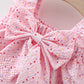 Pink dress with a large bow and heart pattern 