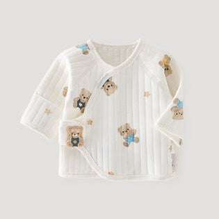 A white long-sleeve baby wrap jacket with a vertical ribbed texture and teddy bear prints, shown on a light gray background.