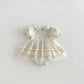 Baby romper with floral pattern on a white background