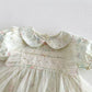 Floral dress with lace details on a white background
