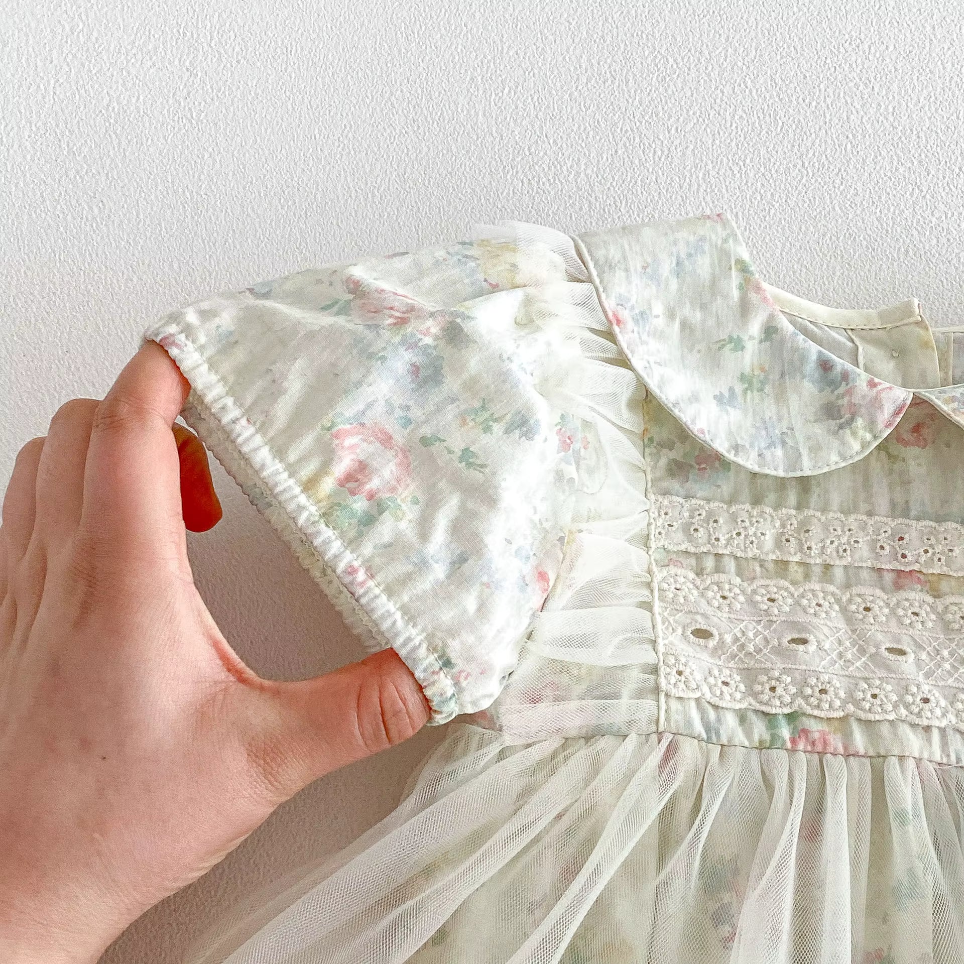 Bubble sleeves on a floral dress with lace details for baby girls