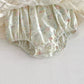 Floral-patterned baby bloomers on a white background